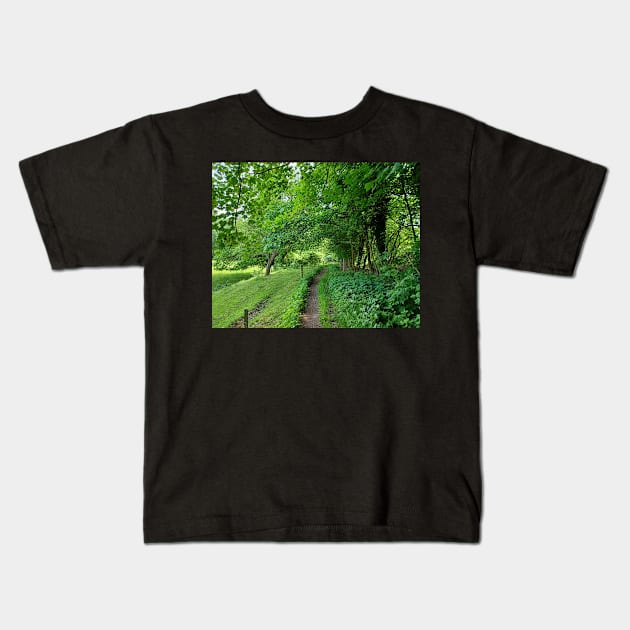 Morning walk through field and forest Kids T-Shirt by Trine